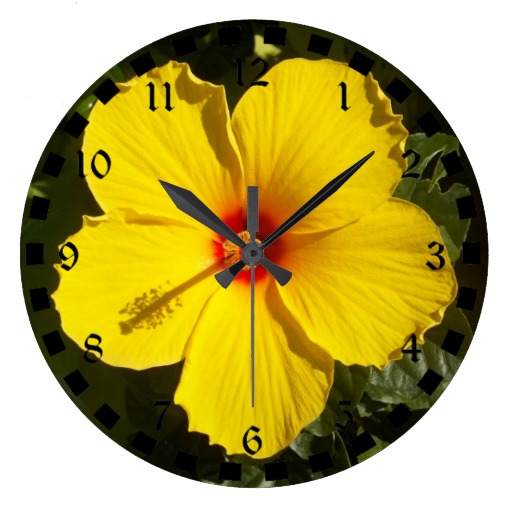 Sunshine Yellow Tropical Hibiscus Flower Wall Clocks from Zazzle.